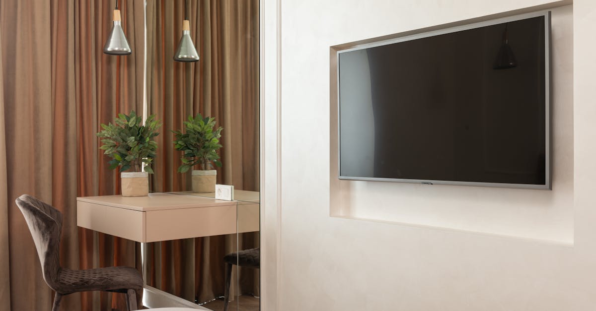 Modern hotel room with wall-mounted television, similar to Foxtel Business iQ rooms in Fortescue mining camps