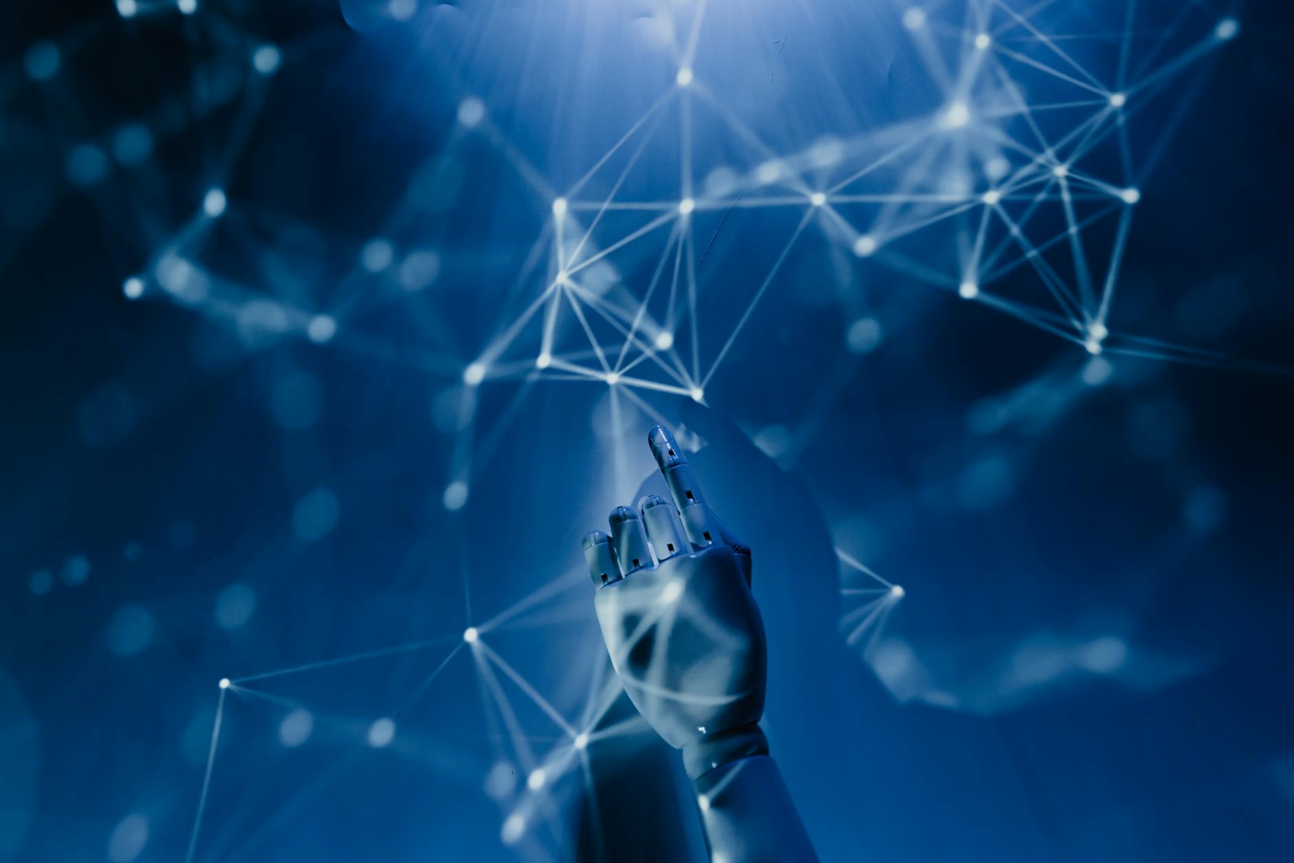 A robotic hand reaching into a digital network, symbolising AI technology and government adoption