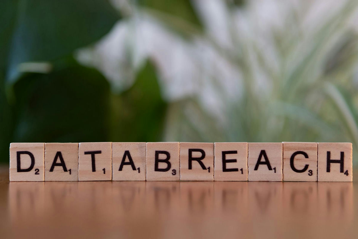 Scrabble tiles spelling 'data breach' on a table, illustrating personal data exposure risks
