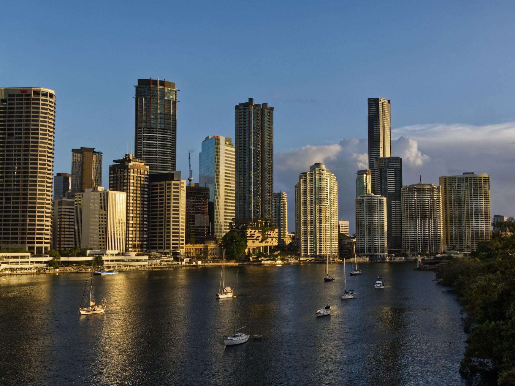 Brisbane CBD skyline reflected in the river at sunset