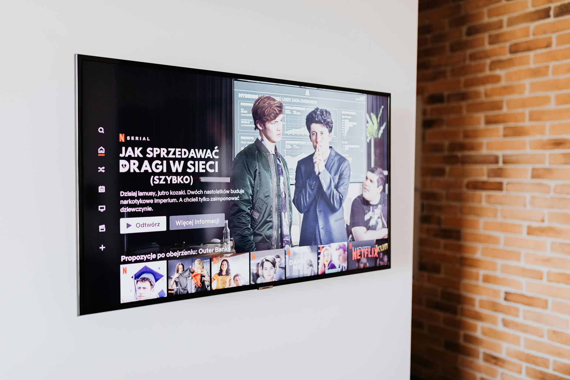 Modern flat screen TV mounted on wall in stylish living room setting