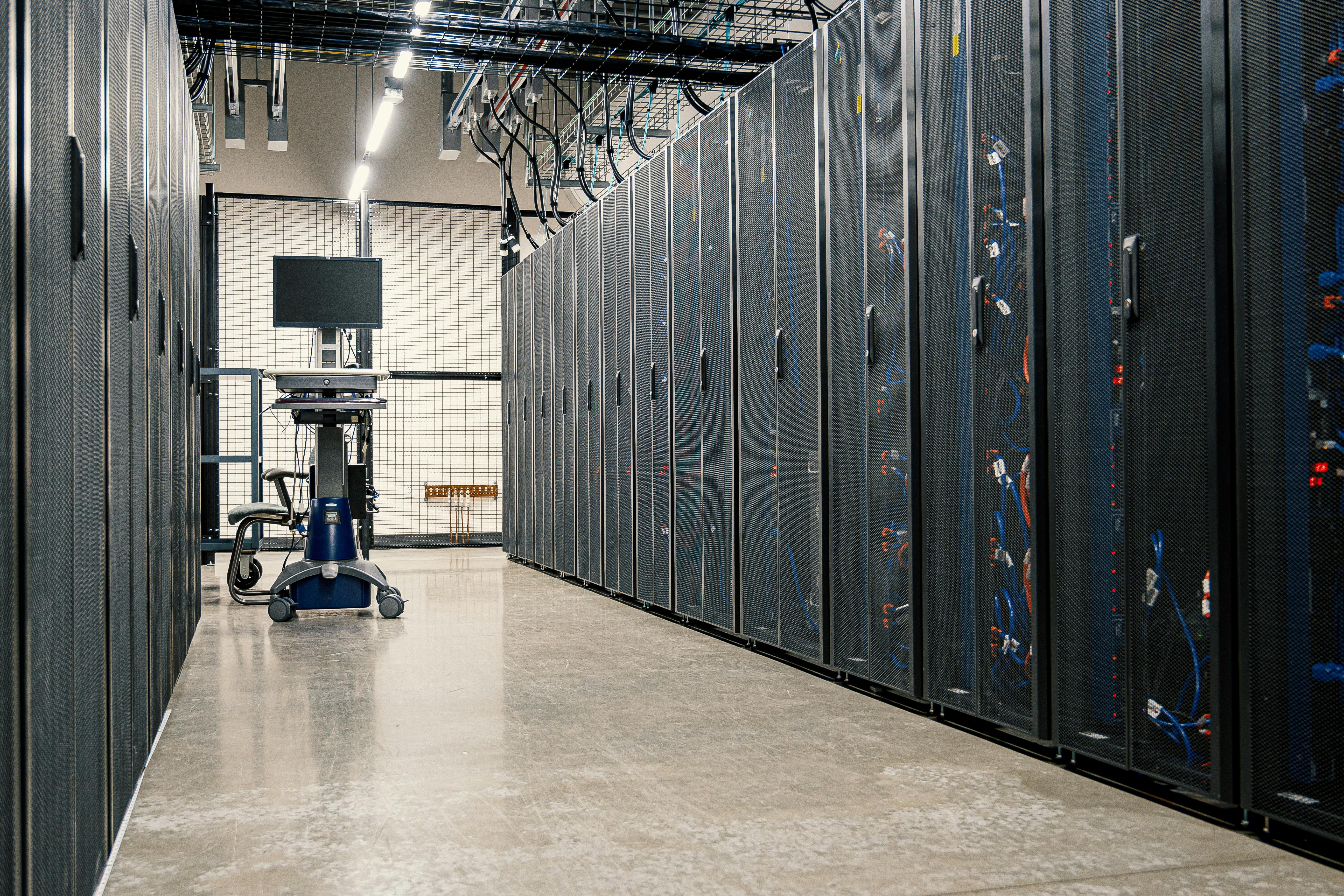 Data center server racks with network cables in a modern facility