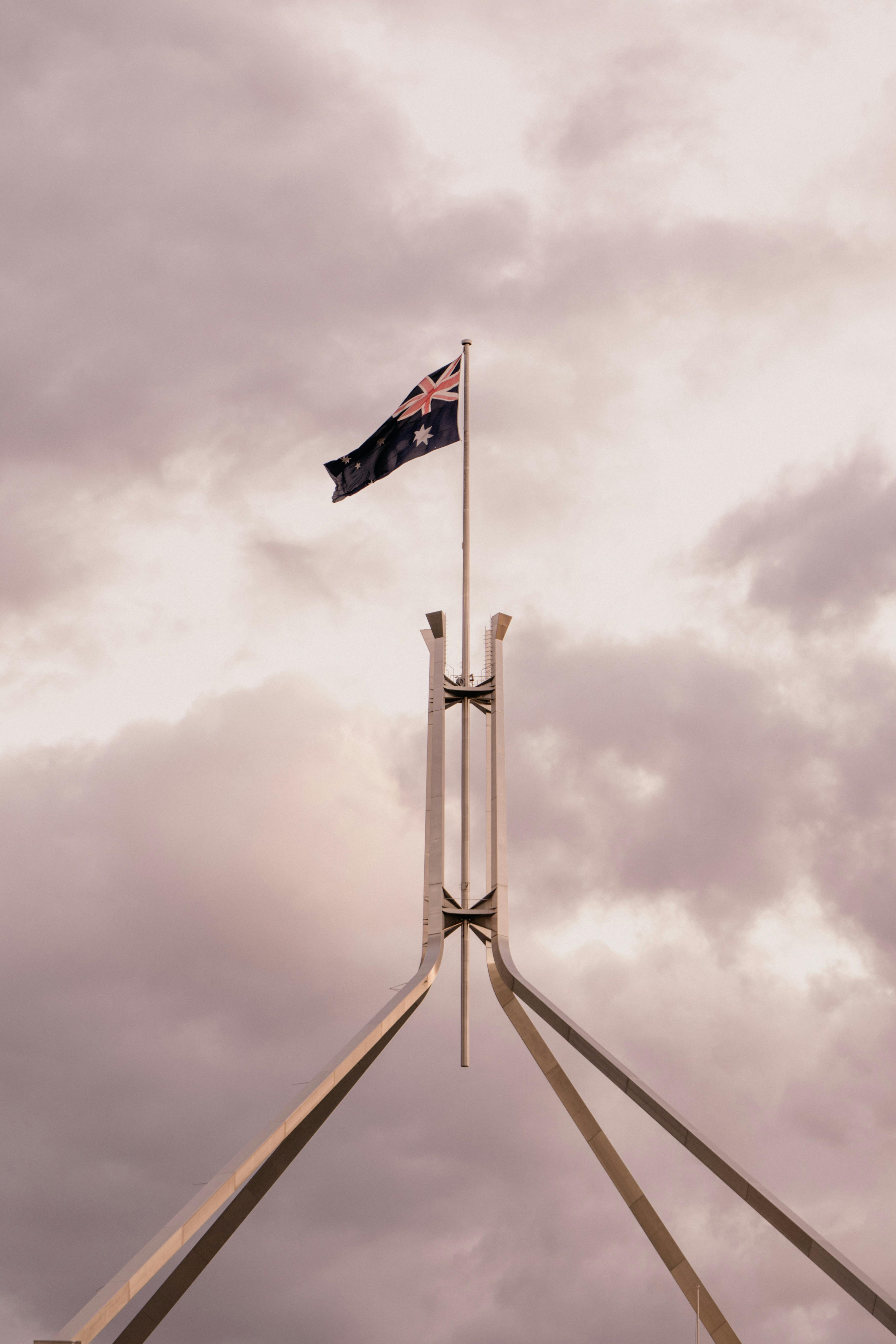 Australian flag flying over Parliament House in Canberra