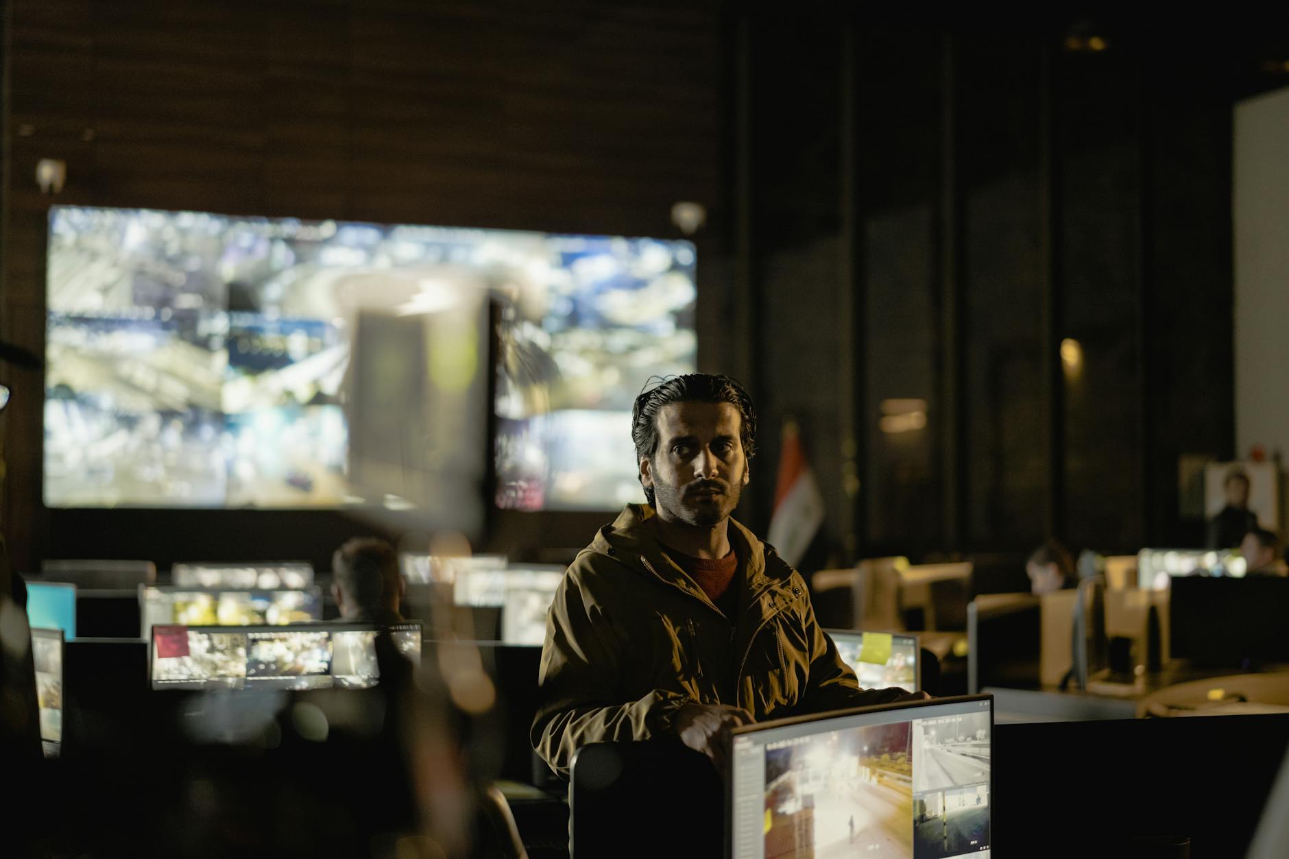 Security operations centre monitors cyber threats on multiple screens