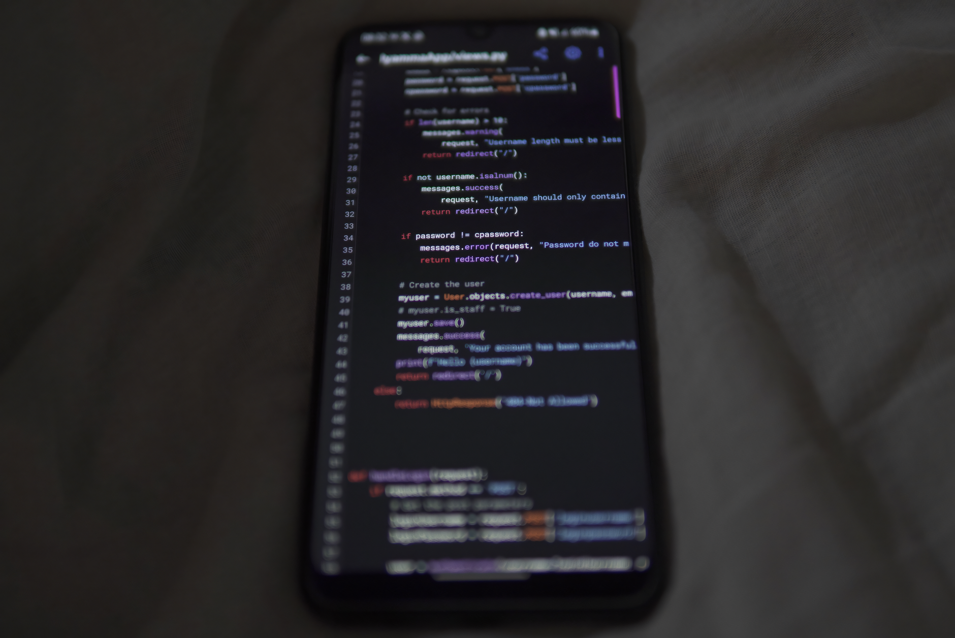 Smartphone displaying code during mobile app development