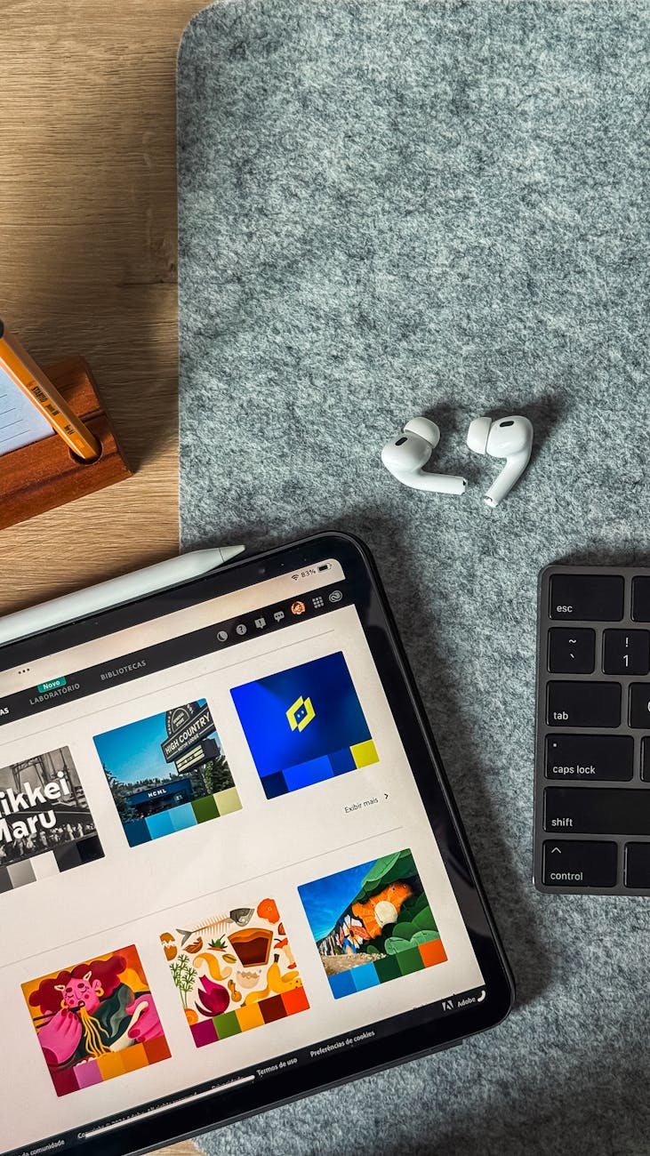 Workspace with iPad, keyboard and AirPods set up for study