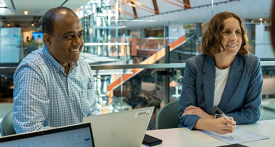 Commonwealth Bank employees in a newsroom image