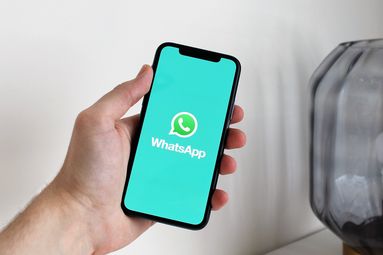 Smartphone screen displaying the WhatsApp app, illustrating messaging account security risks