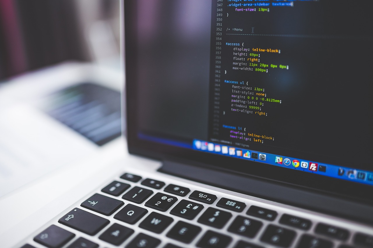Close-up of code on a laptop screen, illustrating AI-assisted software development.
