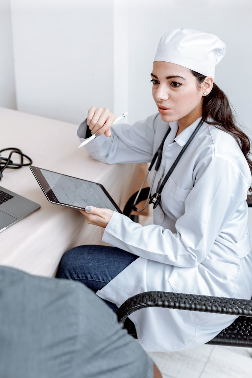 Medical professional using tablet in clinical setting