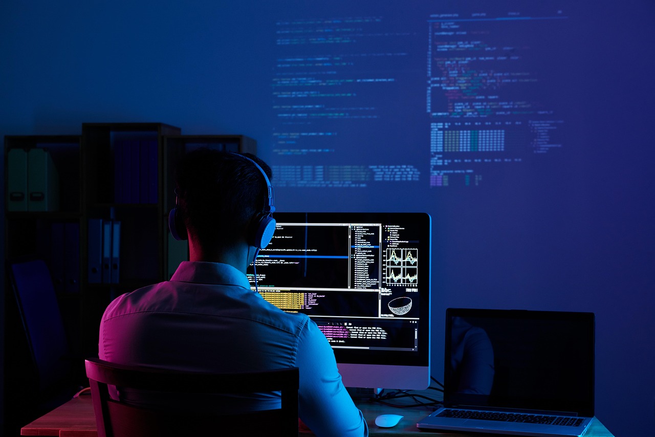 Software developer working at a desk as AI coding tools move to metered pricing