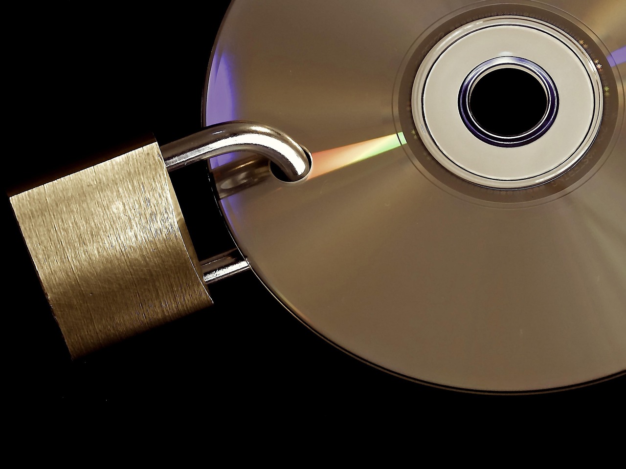 Padlock and digital media representing enterprise data privacy controls