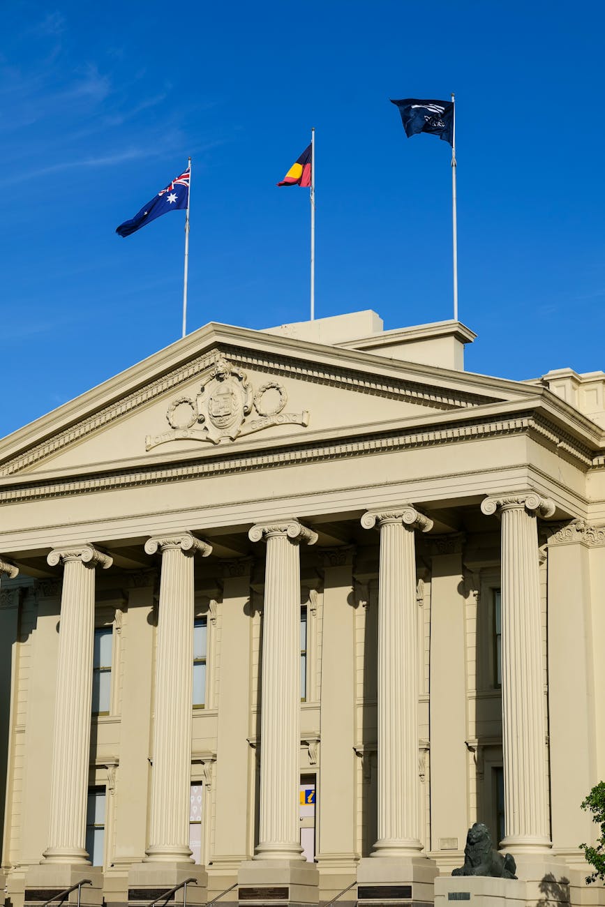 Australian town hall with flags, representing local government planning and public-sector governance