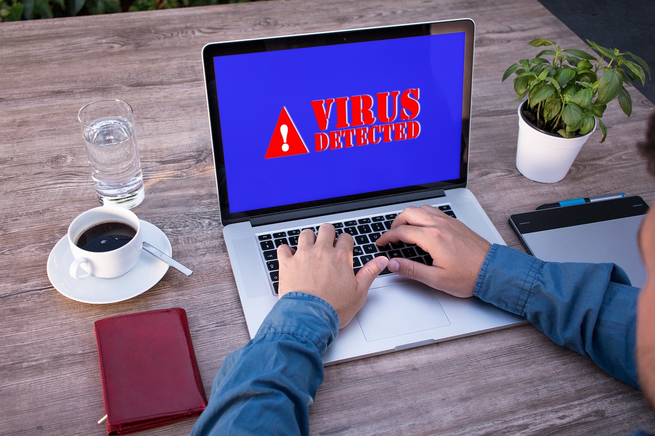 A malware warning displayed on a laptop screen